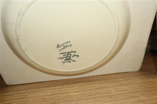 Three Clarice Cliff dishes and similar style napkin rings